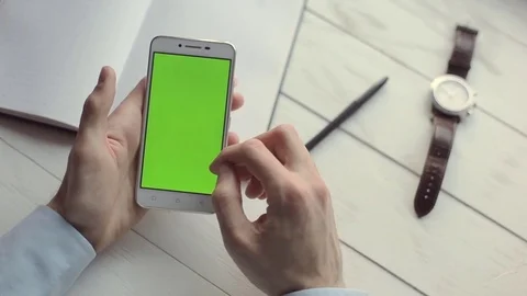 Businessman using mobile phone with green screen. Stock Footage 74869313