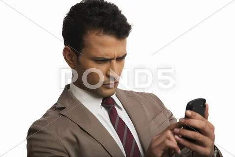 Businessman using a mobile phone Stock Photos