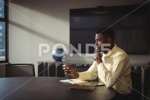Businessman using mobile phone Stock Photos