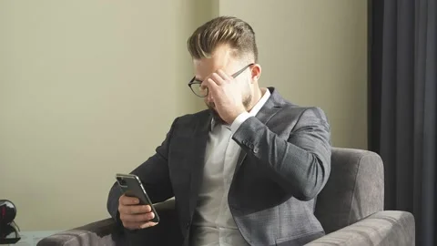 Businessman using mobile phone, typing message to partners after conference Stock Footage 150551885