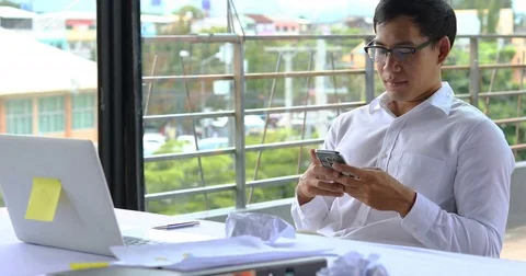 Businessman using mobile phone in working time Stock Footage 85073935