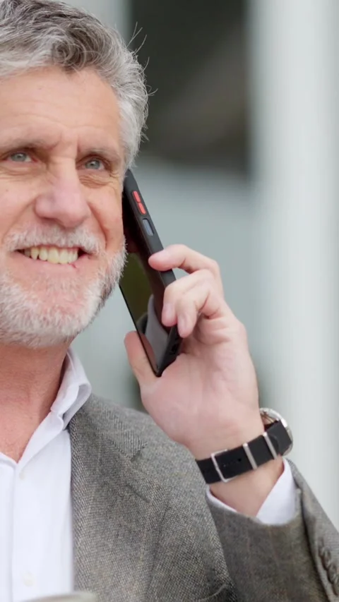 Businessman using the mobile while holding a take away coffee Видео 244743314