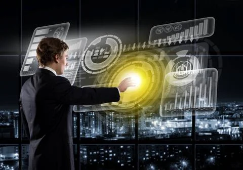 Businessman using modern technologies Back view of businessman working wit... Stock Photos