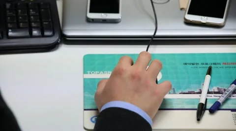 Businessman using a mouse on the office desk Video stock 46737614
