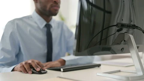 Businessman Using Mouse while Working on Desktop Stock Footage 146480406