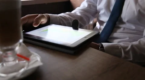 Businessman using a pad in a cafe Stock Footage 54689771