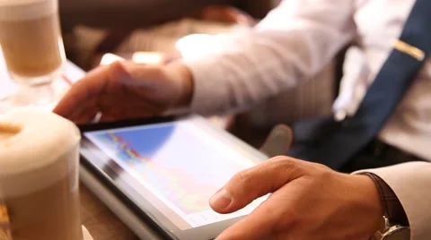 Businessman using a pad in a cafe Video stock 54689851