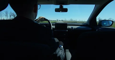 A businessman is using  self pilot on a futuristic screen with holograms. Video stock 115359566