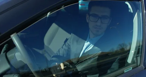 A businessman is using  self pilot on a futuristic screen with holograms. Video stock 115359868