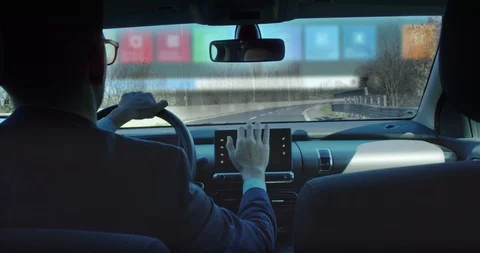 A businessman is using  self pilot on a futuristic screen with holograms. Video stock 115360936