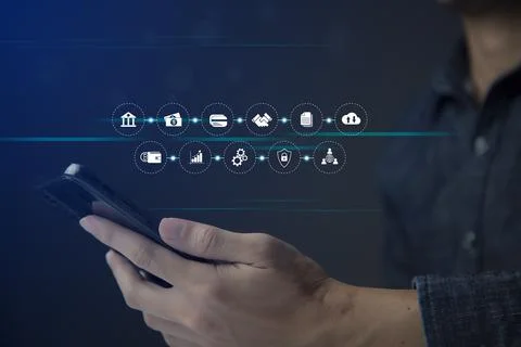 Businessman using smart phone to do online transactions with internet technol Stock Photos