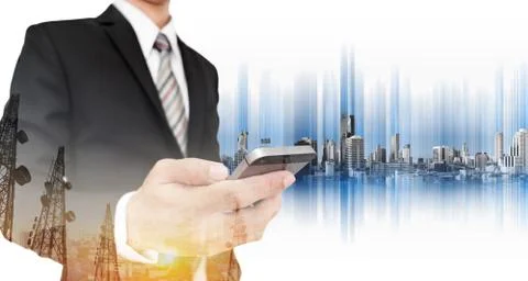 Businessman using smart phone, with double exposure telecommunication towers Stock Photos