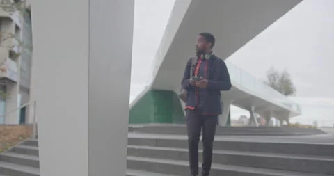 Businessman using Smart phone Technology Walking to Office Stock Footage 212596773