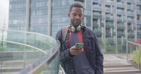 Businessman using Smart phone Technology Outside Office Stock Footage 212599407