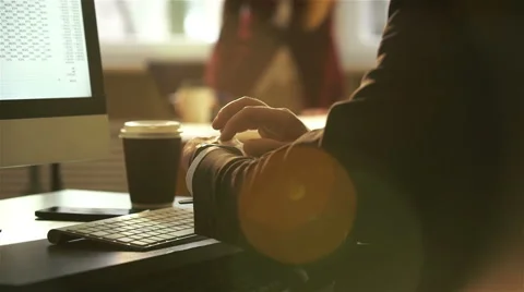 Businessman using smart Watch and computer keyboard in the office. Slow motion. Video stock 60238079