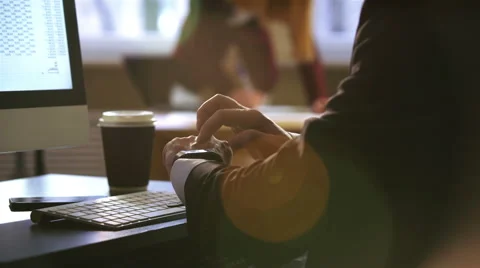 Businessman using smart Watch and computer keyboard in the office. Close-up. 4k. Video stock 60238181