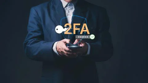 Businessman using smartphone with 2fa security icon Stock Photos