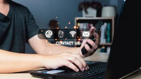 Businessman using smartphone and computer laptop with virtual screen contac.. Stock Photos