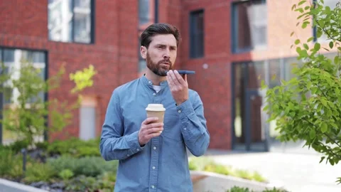 Businessman Using Smartphone and Drinking Coffee Outdoors Stock-Footage 308993953