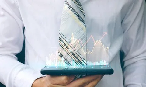 Businessman using a smartphone and technology network concepts Stock Photos