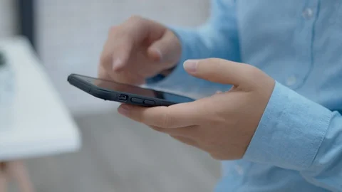 Businessman Using Smartphone browsing internet, checking email Video stock 128251947