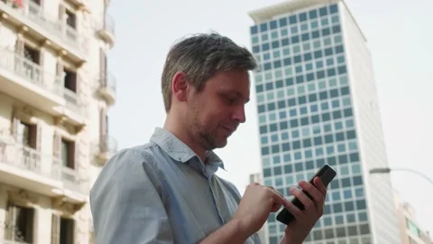 Businessman using smartphone close-up, young man writing message in phone Stock Footage 197079899