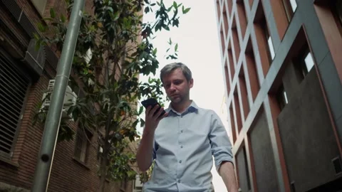 Businessman using smartphone close-up, young man writing message in phone Stock Footage 202290975