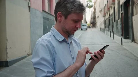 Businessman using smartphone close-up, young man writing message in phone Stock Footage 204924674