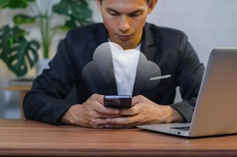 Businessman Using Smartphone with Cloud Computing Concept at Office Desk Stock Photos