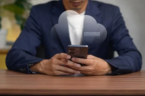 Businessman Using Smartphone with Cloud Technology Concept in Office Stock Photos