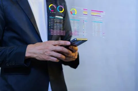 Businessman Using Smartphone with Digital Data and Statistics Display Stock Photos