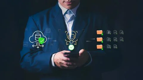 Businessman using smartphone with digital security icons Stock Photos