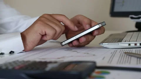 Businessman Using Smartphone During Office Work Stock Footage 346179600
