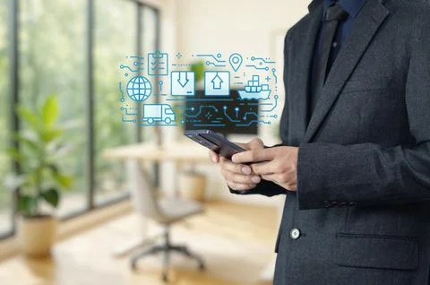 Businessman Using Smartphone with Export and Logistics Icons Foto stock