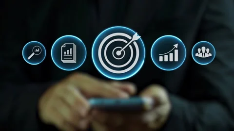 Businessman using smartphone with fire arrow hitting center of a target. Stock Footage 261137927