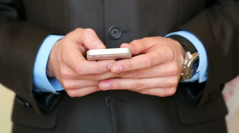 Businessman using smartphone Stock Footage 34365228
