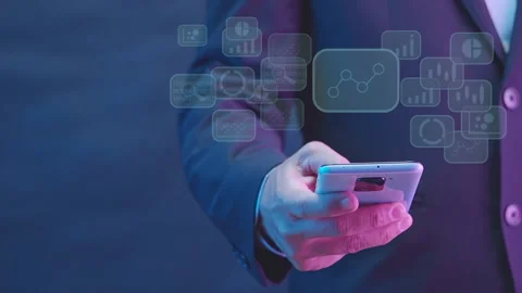 Businessman using smartphone for intelligence dashboard virtual screen. Stock Footage 234780276