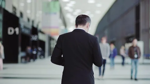Businessman using smartphone on the move Video stock 108681389