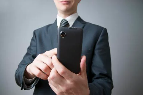 Businessman using smartphone Stock Photos