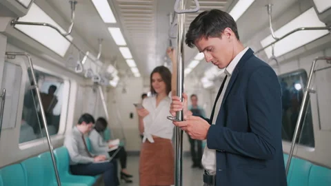 Businessman using smartphone on the skytrain or subway Video stock 150359705