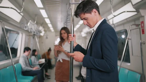 Businessman using smartphone on the skytrain or subway Stock Footage 150359712