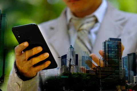 Businessman using smartphone with technology double exposure Stock Photos