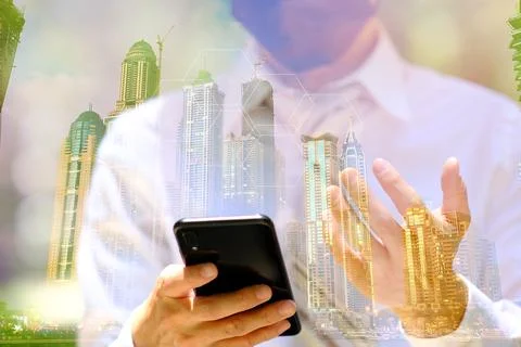 Businessman using smartphone with technology double exposure Stock Photos