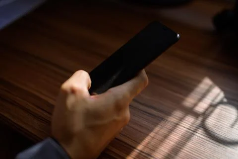 Businessman using smartphone at work Stock Photos