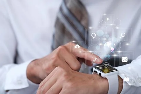 Businessman using smartwatch and virtual screen and internet data and techn.. Stock Photos