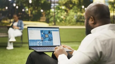 Businessman using software with microchip and circuit board interface 스톡 사진