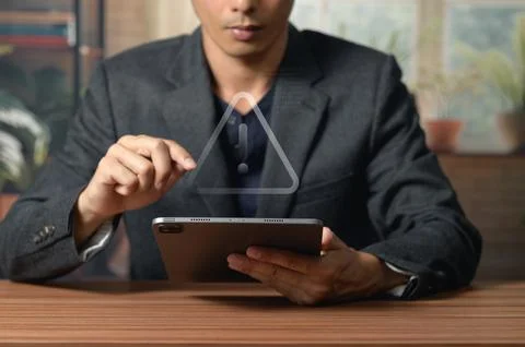 Businessman Using Tablet with Abstract Digital Triangle for Technology Concep Stock Photos