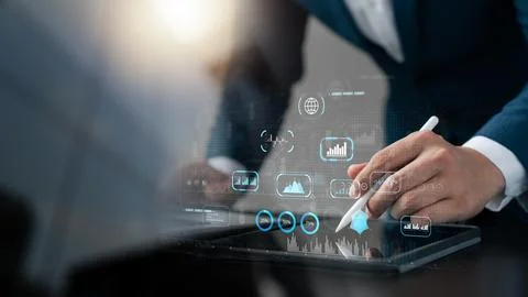 Businessman using tablet analyzing business growth graph data and progress,.. Stock Photos
