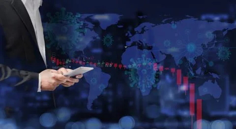 Businessman using tablet analyzing data. World stock graph has down from viru Stock Photos