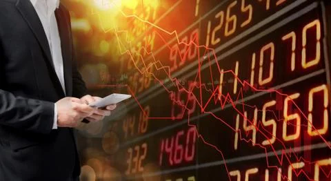 Businessman using tablet analyzing data. He paranoid world of economy finance Foto stock